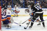 Tampa Bay Lightning left wing Anthony Duclair (10) can't get a shot off in front of New York Islanders goaltender Semyon Varlamov (40) during the second period of an NHL hockey game Saturday, March 30, 2024, in Tampa, Fla. (AP Photo/Chris O'Meara)