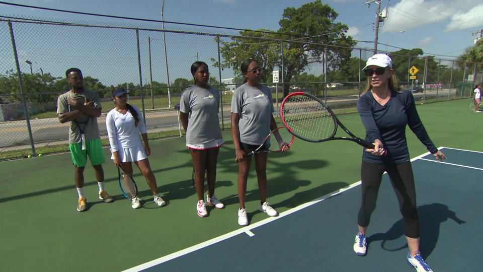 Tennis great Chris Evert gives instructions to young players at the Ashe-Buchholz Tennis Center in Moore Park, Miami.  / Credit: CBS News