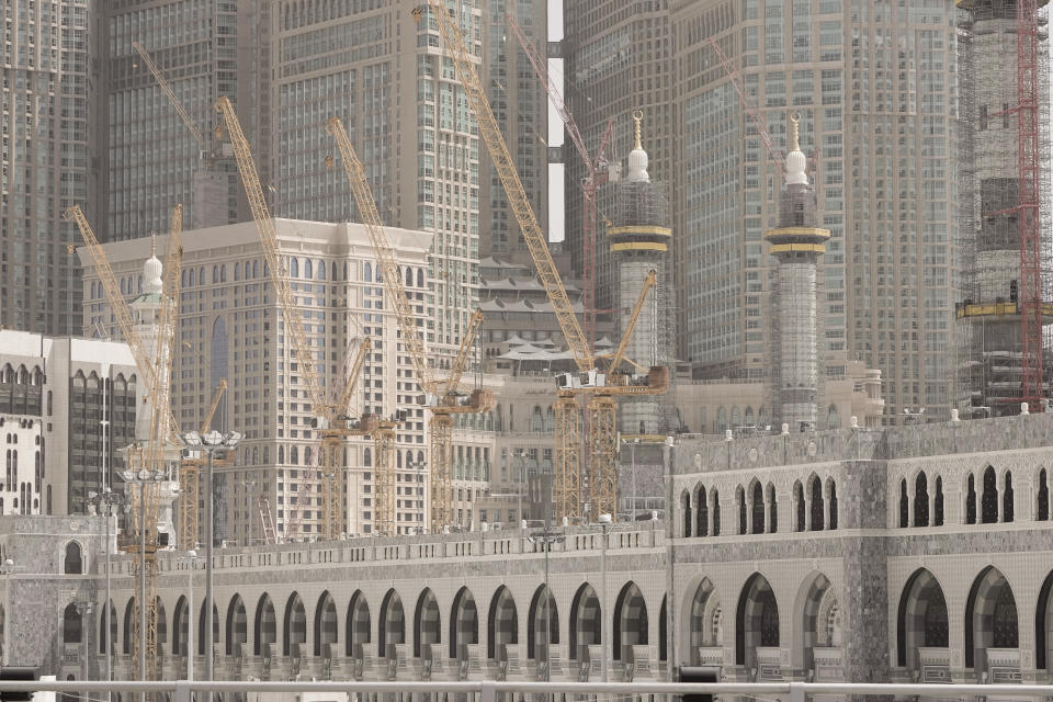 Cranes are seen on the new extension of the Grand Mosque during the Hajj pilgrimage in the Muslim holy city of Mecca, Saudi Arabia, Sunday, June 25, 2023. Saudi Arabia is pumping billions of dollars into the holy city of Mecca to meet its ambitious economic targets, with high-end hotels, apartment blocks, retailers and restaurants planned for areas around the Grand Mosque. (AP Photo/Amr Nabil)