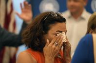 A tearful former state Rep. Katie Arrington, left, speaks with supporters after giving her public support for U.S. Rep. Nancy Mace at a GOP "unity rally" on Thursday, June 16, 2022, in Charleston, S.C. Mace defeated the Trump-backed Arrington in South Carolina's 1st District Republican primary on Tuesday. (AP Photo/Meg Kinnard)