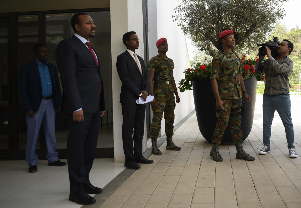 Ethiopian Prime Minister Abiy Ahmed , left, waits for the arrival of US Secretary of State Mike Pompeo at the Prime Minister's office in Addis Ababa, Tuesday Feb. 18, 2020. Pompeo's visit to Africa is the first by a Cabinet official in 18 months. (Andrew Caballero-Reynolds/Pool via AP)