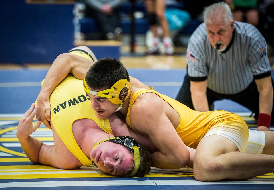 Monroe Central's Hunter Page battles Cowan's Dalton May in the 182-pound wrestling sectional championship at Delta High School Saturday, Jan. 29, 2022.