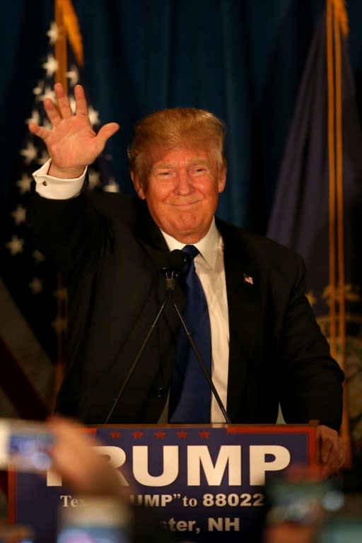 Republican presidential candidate Donald Trump waves to his supporters in Manchester, New Hampshire, on February 9, 2016