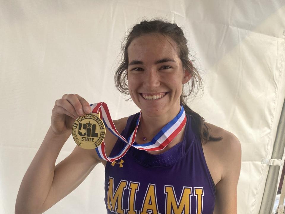 Miami junior Anna Hudson poses with her 1A girls 100 meter gold medal.