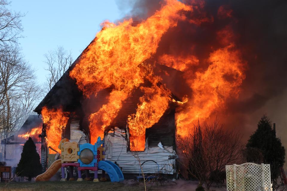 Firefighters from multiple communities battle a two-alarm house fire at 53 Old Bedford Road in East Bridgewater on Sunday, Feb. 4, 2024.