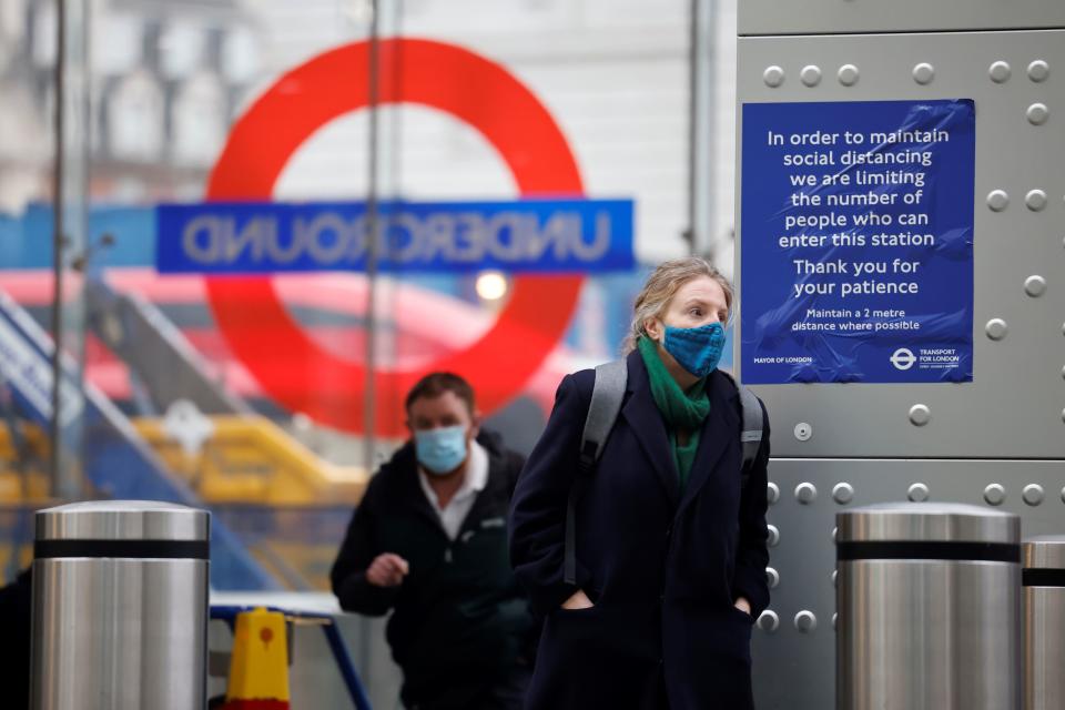 Commuters travel on the London underground. Photo: Tolga Akmen/AFP