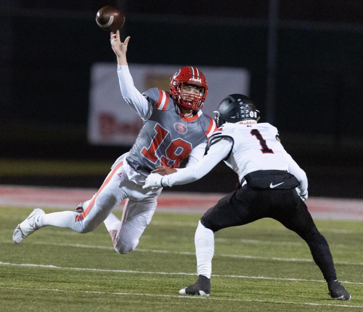 Canton South quarterback Poochie Snyder gets off a second-half pass over Buchtel defender Antwan Hunt in the OHSAA playoffs, Friday, Nov. 3, 2023.