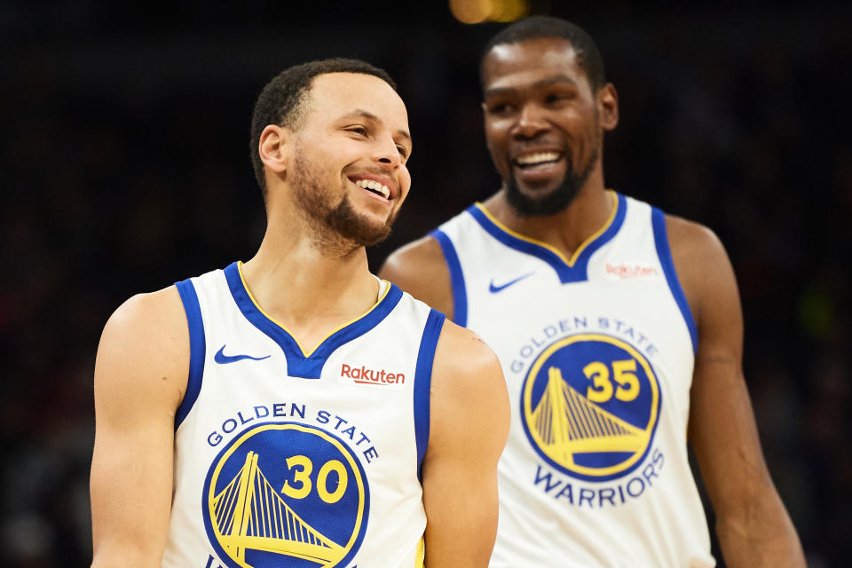 MINNEAPOLIS, MN - MARCH 19: Stephen Curry #30 and Kevin Durant #35 of the Golden State Warriors look on during the game against the Minnesota Timberwolves on March 19, 2019 at the Target Center in Minneapolis, Minnesota. NOTE TO USER: User expressly acknowledges and agrees that, by downloading and or using this Photograph, user is consenting to the terms and conditions of the Getty Images License Agreement. (Photo by Hannah Foslien/Getty Images)