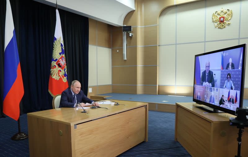 Russian President Vladimir Putin chairs a meeting via a video link in Sochi