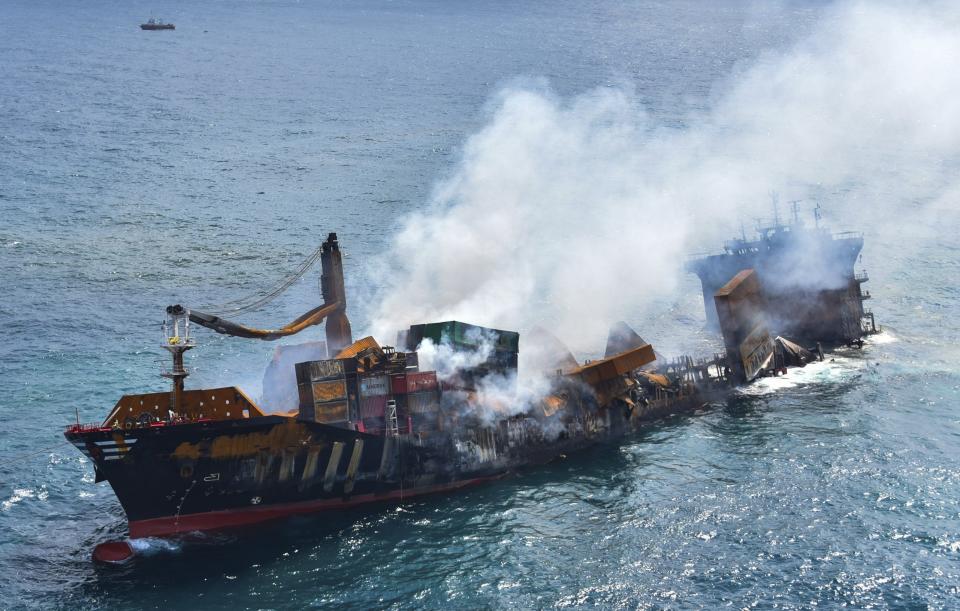 This photo provided by Sri Lankan Air Force shows the sinking MV X-Press Pearl at Kapungoda where it is anchored off Colombo port, Sri Lanka, Wednesday, June 2, 2021. Salvage experts were attempting to tow the fire-stricken container ship that had been loaded with chemicals into the deep sea as the vessel started to sink Wednesday. Water submerged the MV X-Press Pearl's quarterdeck a day after firefighters extinguished a blaze that had been burning for 12 days. (Sri Lanka Air Force via AP)