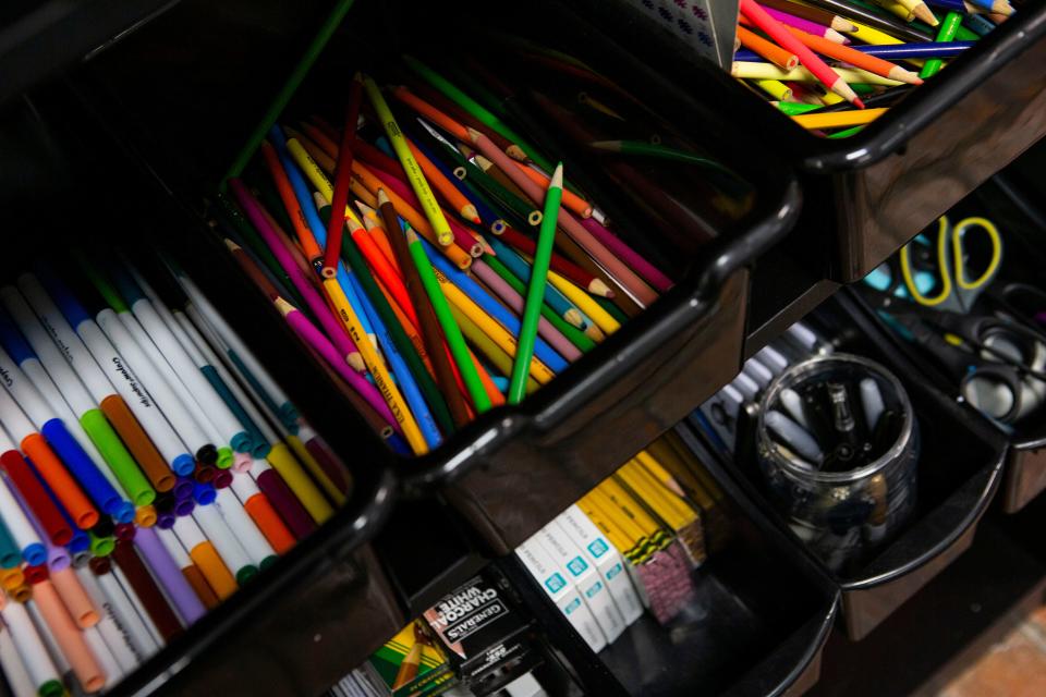 Art supplies lie inside various bins in an art supply case inside Young at Art art studio on Chestnut Street in Lancaster, Ohio on December 3, 2021. Karla Young, a Lancaster native, is the owner of the studio.