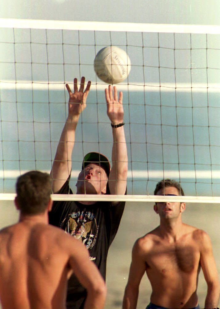 Then president-elect, Clinton played volleyball in Santa Barbara in November 1992.   (PAUL RICHARDS/AFP/Getty Images)