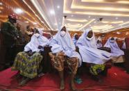 Girls who were kidnapped from a boarding school in the northwest Nigerian state of Zamfara, look on after their release in Zamfara, Nigeria