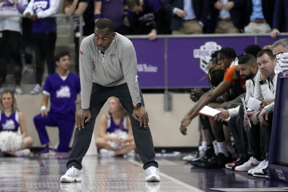 Oklahoma State head coach Mike Boynton watches play against TCU in the second half of an NCAA college basketball game, Saturday, Feb. 18, 2023, in Fort Worth, Texas. (AP Photo/Tony Gutierrez)