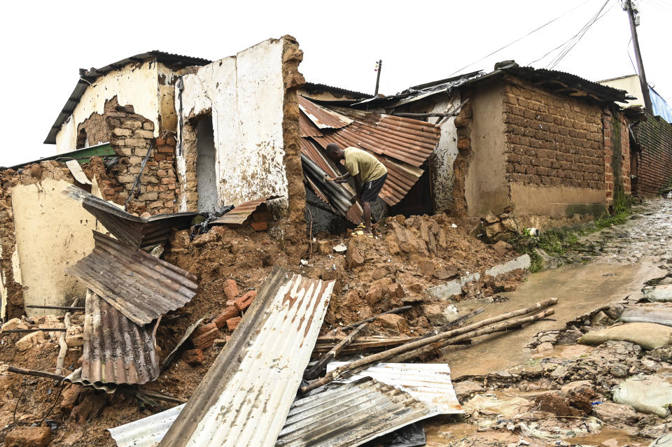 A man checks the damage to his home, destroyed following heavy rains caused by Cyclone Freddy, in Blantyre southern Malawi, Wednesday, March 15, 2023. After barreling through Mozambique and Malawi since late last week and killing hundreds and displacing thousands more, the cyclone is set to move away from land bringing some relief to regions who have been ravaged by torrential rain and powerful winds. (AP Photo/Thoko Chikondi)