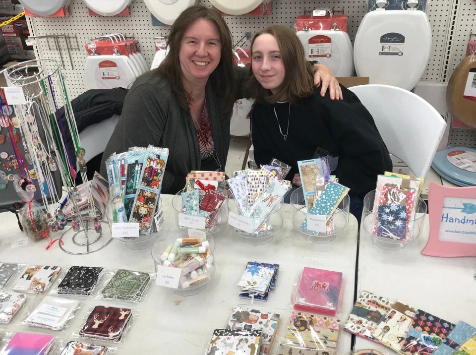 Handmade Bay vendors Monika Wheeler, left, and daughter Rebecca pose Dec. 4 at Parry's Indoor Farmers Market at Parry's General Store in Hamilton. 