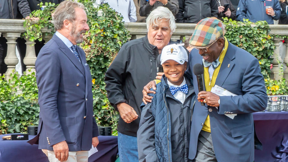 Jay Leno, Kyrie Hosier and Donald Osborne share laughs on stage at the Audrain Newport Concours d'Elegance.