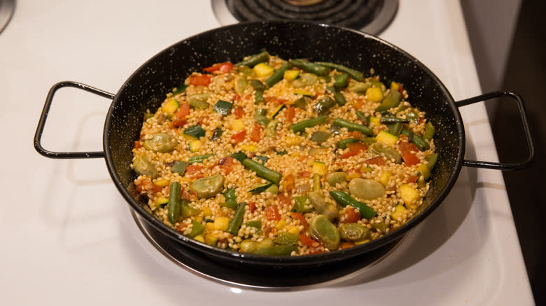 paella cooking on stovetop 