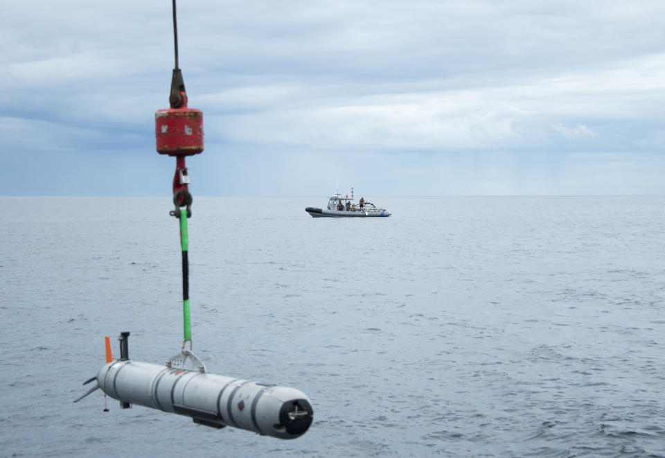 A Mark 18. Mod. 2 Unmanned Underwater Vehicle (UUV) is lowered into the water by the M/V Shelia Bordelon during a mine countermeasures training exercise.<span class="copyright">U.S. Navy photo by Mass Communication Specialist 2nd Class Charles Oki</span>