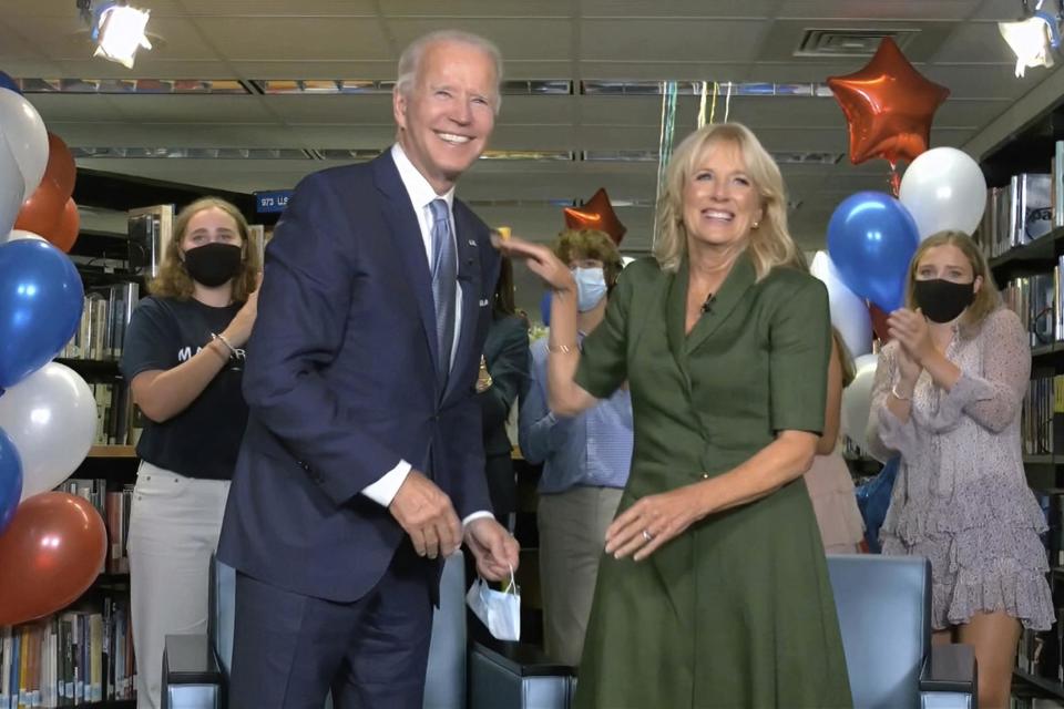 Joe Biden and his wife Jill in a Delaware school library in AugustAP