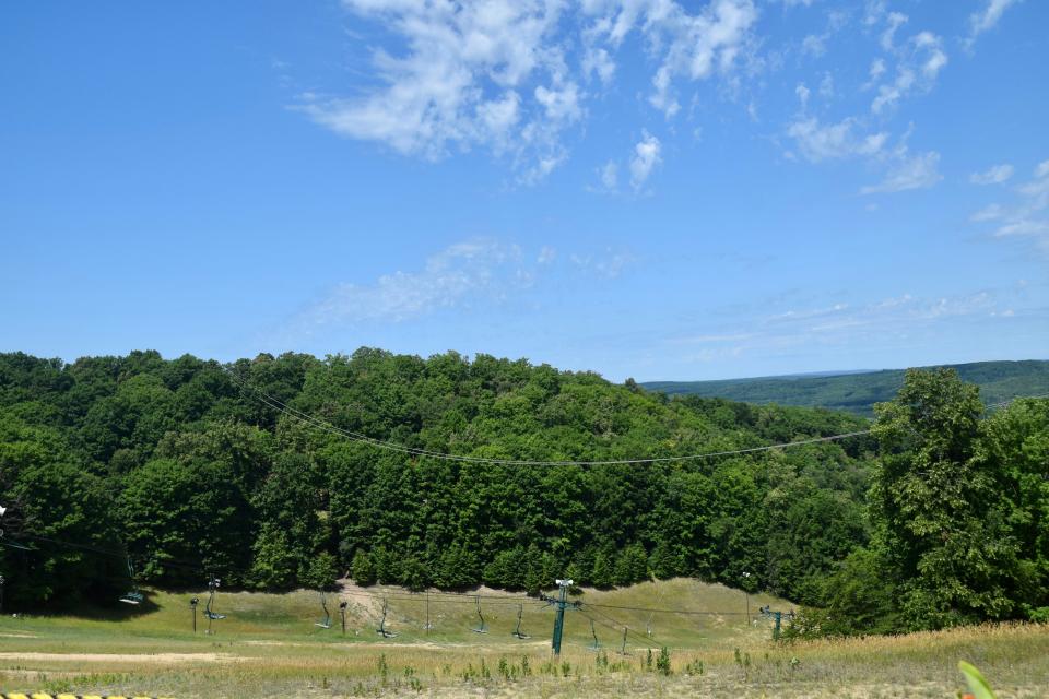 Cables strung between McLouth and Disciples Ridge at Boyne Mountain Resort connect the two timber towers on either peak.