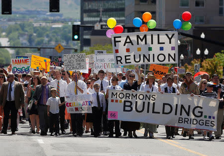 FILE PHOTO - Active Mormons and members of the Boy Scouts of America march in a gay pride parade with members of LGBT community and their supporters as part of the Utah Pride Festival in Salt Lake City, Utah, U.S. on June 2, 2013. REUTERS/Jim Urquhart/File Photo