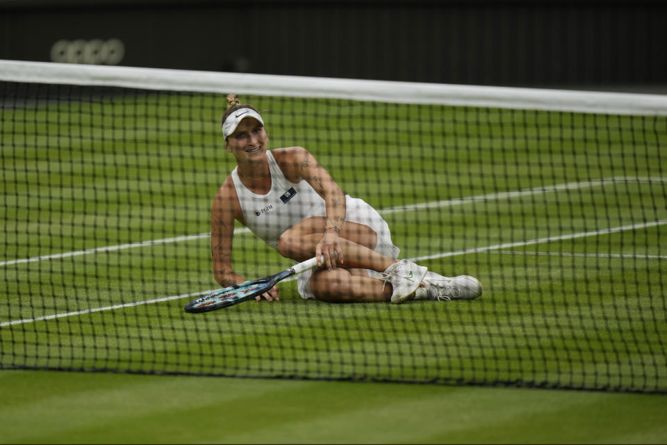 Czech Republic's Marketa Vondrousova celebrates after winning against Tunisia's Ons Jabeur in the women's singles final on day thirteen of the Wimbledon tennis championships in London, Saturday, July 15, 2023. (AP Photo/Alastair Grant)