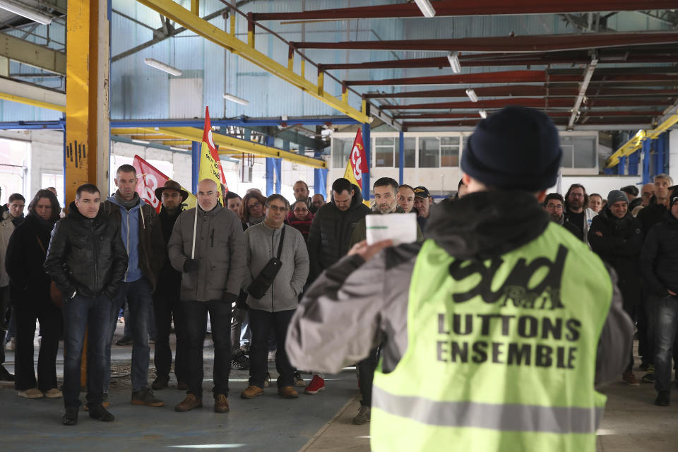 Railway workers gather during a meeting of the CGT and Sud Rail unions in Rennes, western France, Monday, Dec. 9, 2019. Unions launched nationwide strikes and protests over the government's plan to overhaul the retirement system. Paris commuters inched to work Monday through exceptional traffic jams, as strikes to preserve retirement rights halted trains and subways for a fifth straight day. (AP Photo/David Vincent)