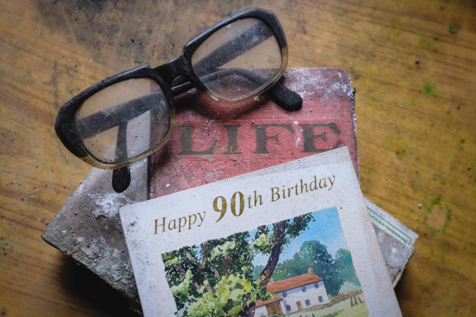 Spectacles and a 90th birthday card are seen inside an abandoned home in Northern Ireland on March 12, 2018. (Photo: Unseen Decay/Mercury Press/Caters News)