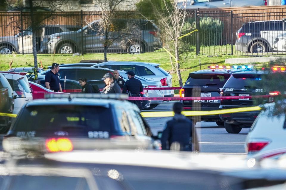 Austin police investigate the scene where an officer fatally shot a man who was brandishing a BB gun near an apartment complex in Northeast Austin on Dec. 26.