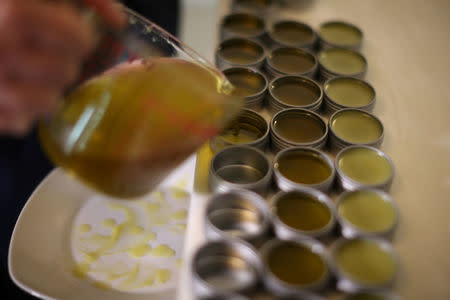 California "weed nun" Desiree Calderon, who goes by the name Sister Freya, pours CBD salve made from hemp at Sisters of the Valley near Merced, California, U.S., April 18, 2017. REUTERS/Lucy Nicholson
