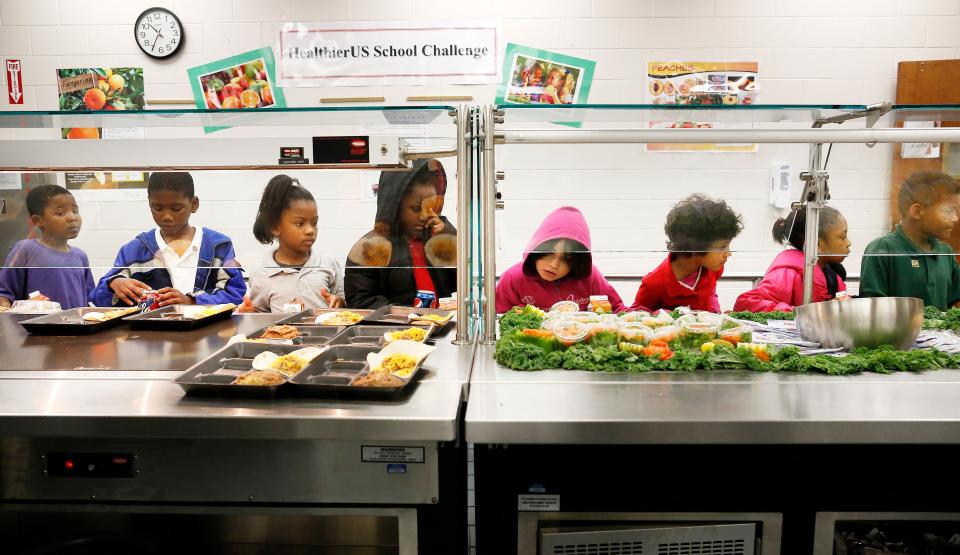 Metcalfe Elementary School students have school lunch Wednesday, December 12, 2012. Metcalfe and Rawlings Elementary schools have been recognized as winners of the Gold Award of Distinction. The Healthier US School Challenge, is a federal program that rewards the creation of a healthier school environment by improving food and beverage offerings, teaching students about nutritious food choices, being physically active, providing opportunities for physical activity, and having supportive school wellness policies.