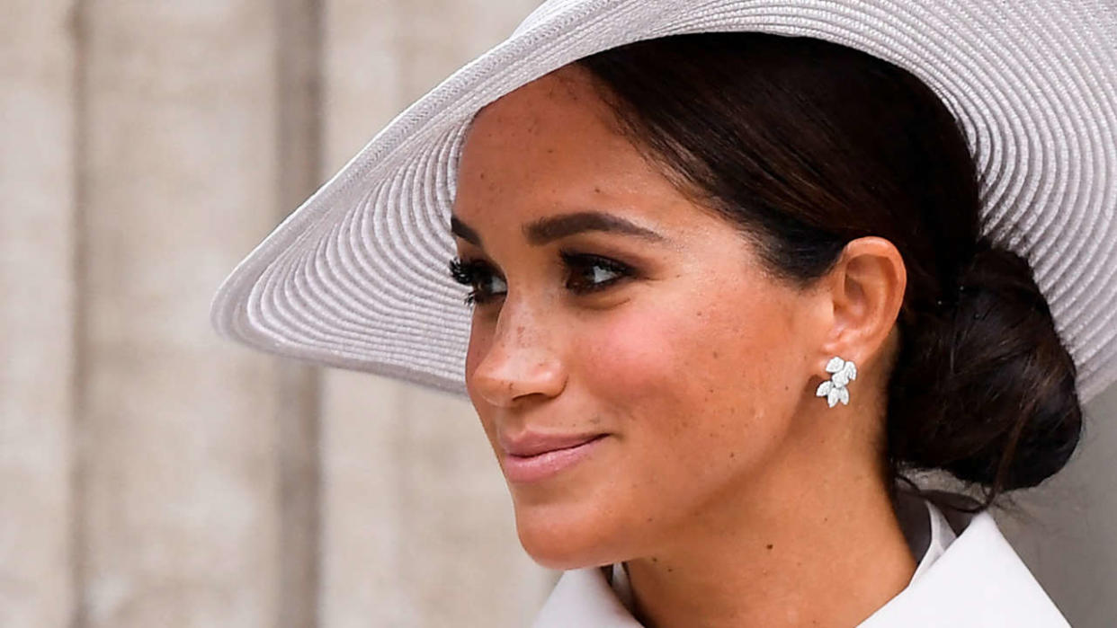 Britain's Meghan, Duchess of Sussex, leaves at the end of the National Service of Thanksgiving for The Queen's reign at Saint Paul's Cathedral in London on June 3, 2022 as part of Queen Elizabeth II's platinum jubilee celebrations. - Queen Elizabeth II kicked off the first of four days of celebrations marking her record-breaking 70 years on the throne, to cheering crowds of tens of thousands of people. But the 96-year-old sovereign's appearance at the Platinum Jubilee -- a milestone never previously reached by a British monarch -- took its toll, forcing her to pull out of a planned church service. (Photo by TOBY MELVILLE / POOL / AFP)