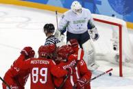 Ice Hockey – Pyeongchang 2018 Winter Olympics – Men Preliminary Round Match – Olympic Athletes from Russia v Slovenia - Gangneung Hockey Centre, Gangneung, South Korea – February 16, 2018 - Olympic Athletes from Russia celebrate a goal scored by teammate Kirill Kaprizov. REUTERS/Grigory Dukor