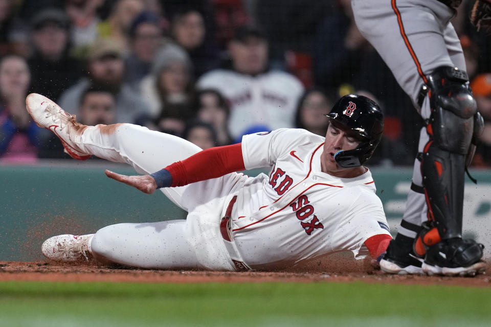 Boston Red Sox's Roy Gonzalez scores on a two-run single by Connor Wong during the fourth inning of a baseball game against the Baltimore Orioles, Wednesday, April 10, 2024, in Boston. (AP Photo/Charles Krupa)