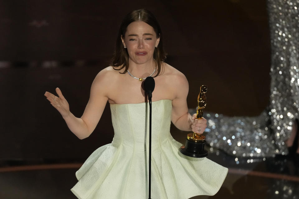 Emma Stone accepts the award for best performance by an actress in a leading role for "Poor Things" during the Oscars on Sunday, March 10, 2024, at the Dolby Theatre in Los Angeles. (AP Photo/Chris Pizzello)