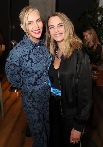 <p>Phillip Faraone/Getty</p> Charlize Theron and Cara Delevingne