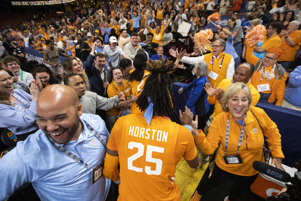 Tennessee fans cheer for player Jordan Horston (25) after they upset LSU 69-67 to advance to the championship game in the second half of an NCAA college basketball during the Southeastern Conference women's tournament in Greenville, S.C., Saturday, March 4, 2023. (AP Photo/Mic Smith)