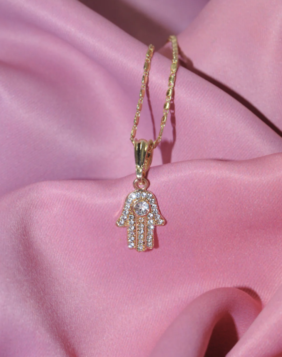 <p><a href="https://xipiteca.com/products/hamsa-sparkly-positivity-necklace?_pos=1&_sid=4db4e5591&_ss=r" rel="nofollow noopener" target="_blank" data-ylk="slk:Shop Now;elm:context_link;itc:0;sec:content-canvas" class="link ">Shop Now</a></p><p>All collections</p><p>$2023.00</p><p>xipiteca.com</p>