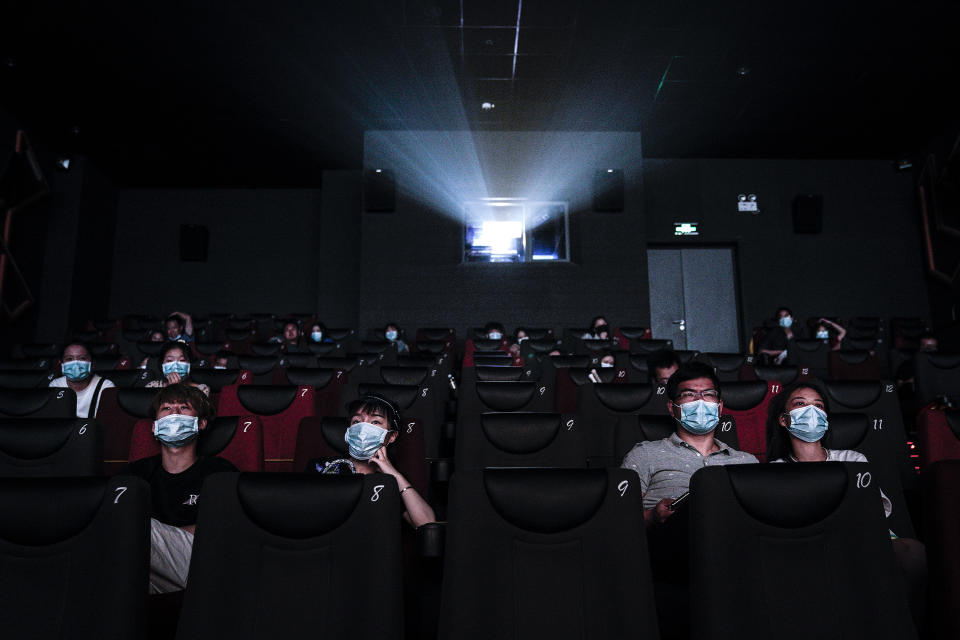 WUHAN, CHINA - JULY 20: (CHINA OUT)Residents watch a movie in a cinema in Wuhan on July 20, 2020 in Wuhan ,Hubei Province,China.Taking various measures against COVID-19, cinemas in the city reopened in an orderly manner on Monday. The China Film Administration, in a circular last week, allowed cinemas in low-risk areas to resume operation with effective epidemic prevention measures in place. (Photo by Getty Images)