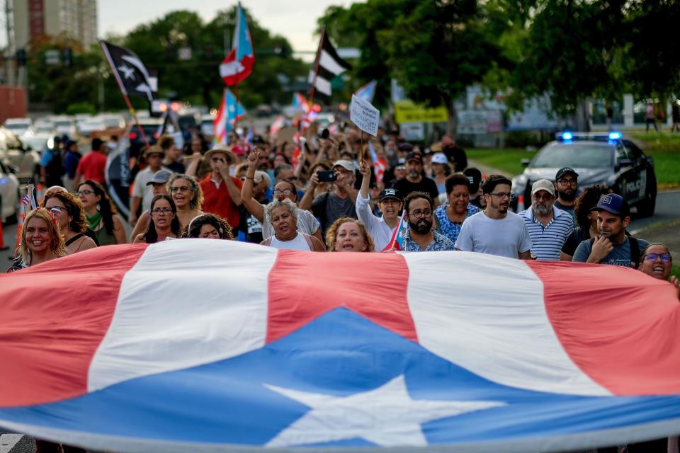 People march in protest in San Juan on July 29, 2019, against the next-in-line for Puerto Rico's governorship, Wanda V&aacute;zquez. (Photo: RICARDO ARDUENGO via Getty Images)