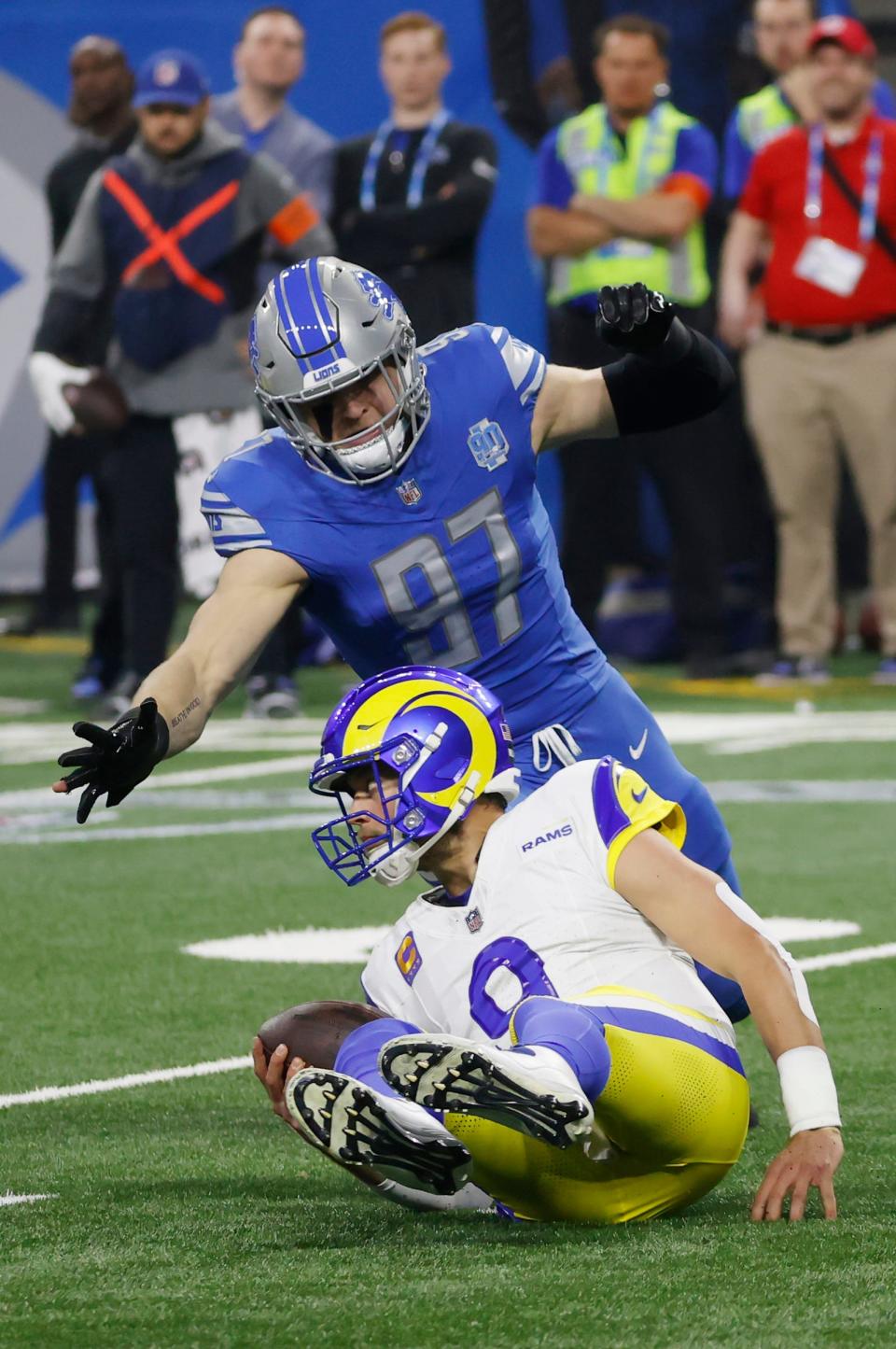 Detroit Lions defensive end Aidan Hutchinson closes in on L.A. Rams quarterback Matthew Stafford after Stafford lost his footing during the first half of the wild-card round of the NFC playoffs at Ford Field in Detroit on Sunday, Jan. 14, 2024.
