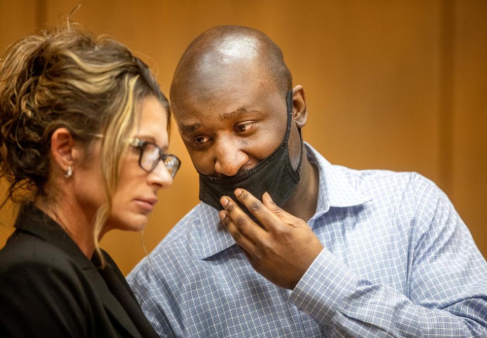 Marcelle Waldon confers with defense attorney Debra Tuomey at the defense table during a jury break in his trial in Bartow. For a moment, Tuesday, it appeared Waldon might testify in his defense. But he decided not to.