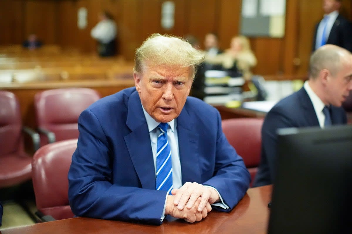 Former President Donald Trump awaits the start of proceedings on the second day of jury selection at Manhattan criminal court (AP)