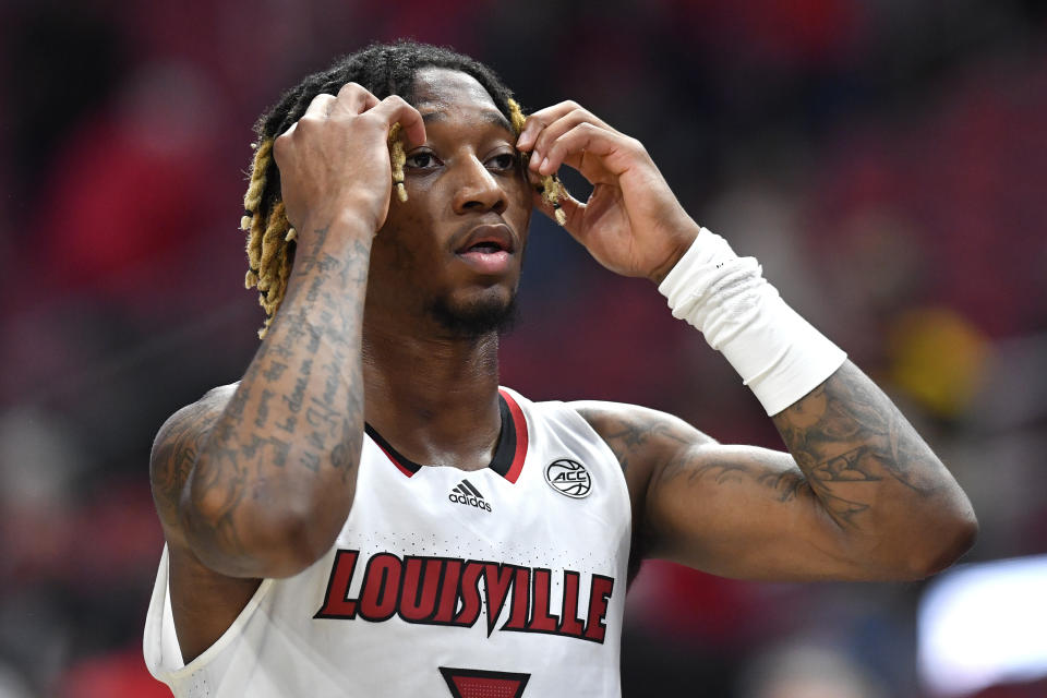 Louisville guard El Ellis (3) walks off the court after missing the game winning shot at the buzzer during a 61-60 loss to Appalachian State following an NCAA college basketball game in Louisville, Ky., Tuesday, Nov. 15, 2022. Appalachian State won 61-60. (AP Photo/Timothy D. Easley)