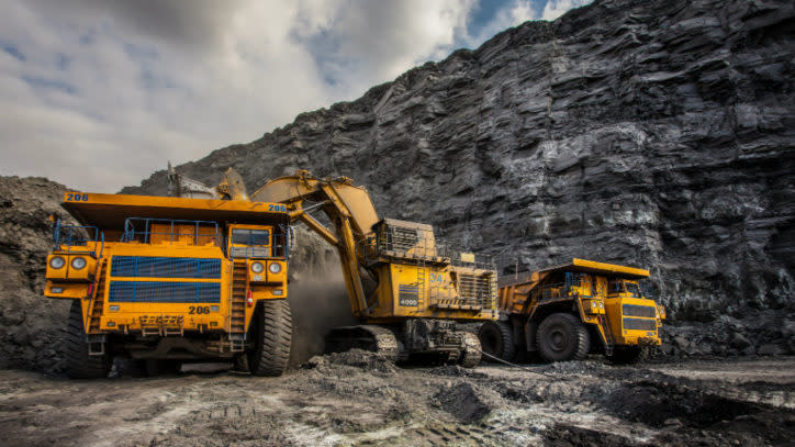 Diggers and trucks in a coal mine