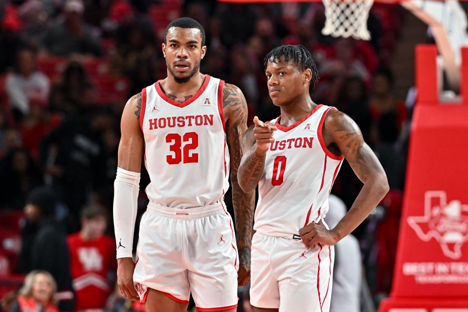 Houston guard Marcus Sasser (0) and forward Reggie Chaney (32) stand on the court during the first half of their game against the Texas Southern at Fertitta Center.