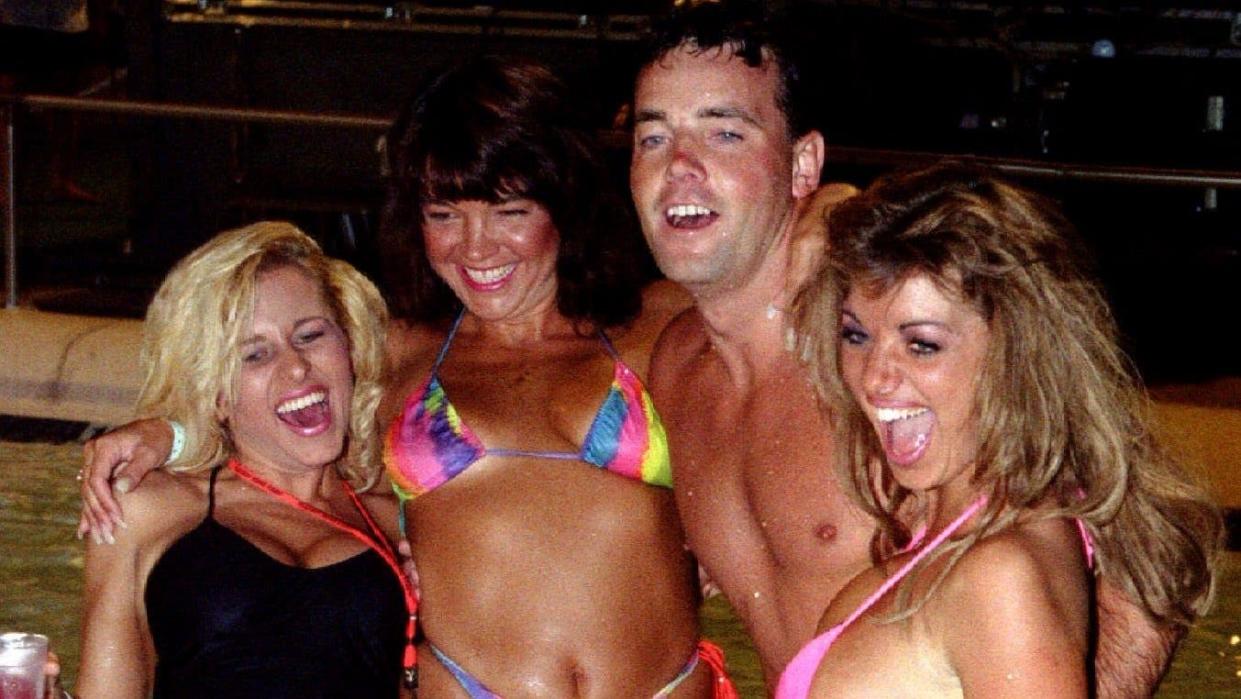 John Wayne Bobbitt in a pool with three Playboy models