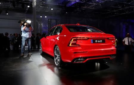 A cameraman gets video of the Volvo S60 during the inauguration of Volvo Cars first U.S. production plant in Ridgeville, South Carolina, U.S., June 20, 2018. REUTERS/Randall Hill