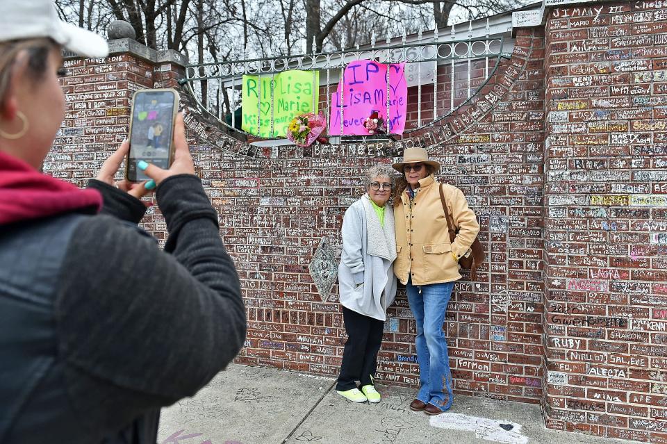 Stephanie Inge and Rhonda Eick gather outside Graceland to pay their respects to Lisa Marie Presley on January 13, 2023 in Memphis, Tennessee.